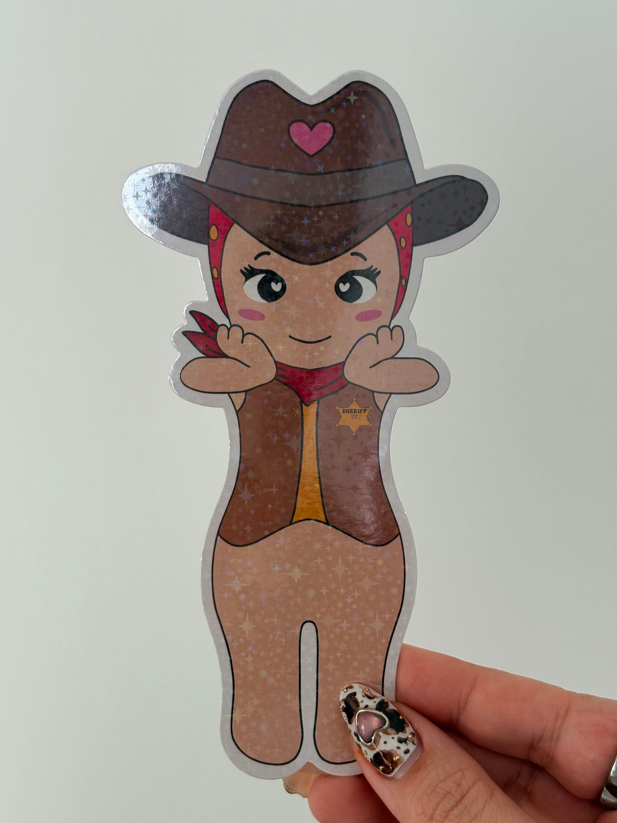 Cute chibi cowgirl sheriff sticker with a brown hat and heart detail