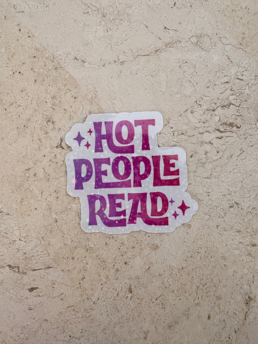 Purple gradient sticker with text 'HOT PEOPLE READ' and stars on a stone surface.