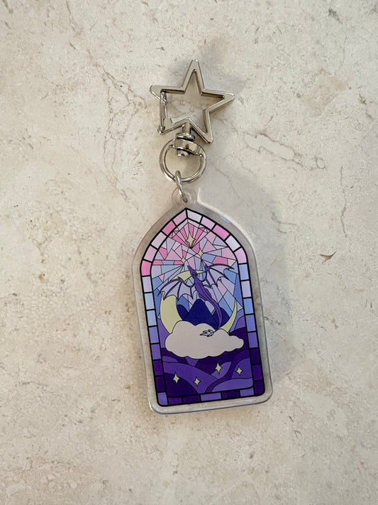 Stained glass style acrylic keychain with a celestial design and star-shaped clasp