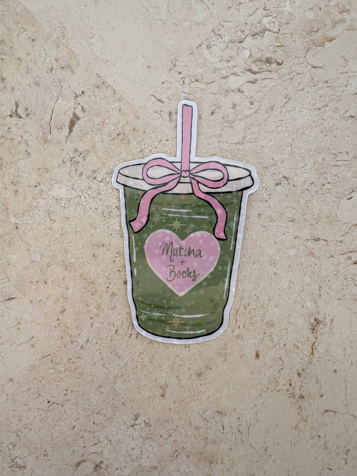 Matcha Books sticker featuring a green tea drink with a pink bow and heart.