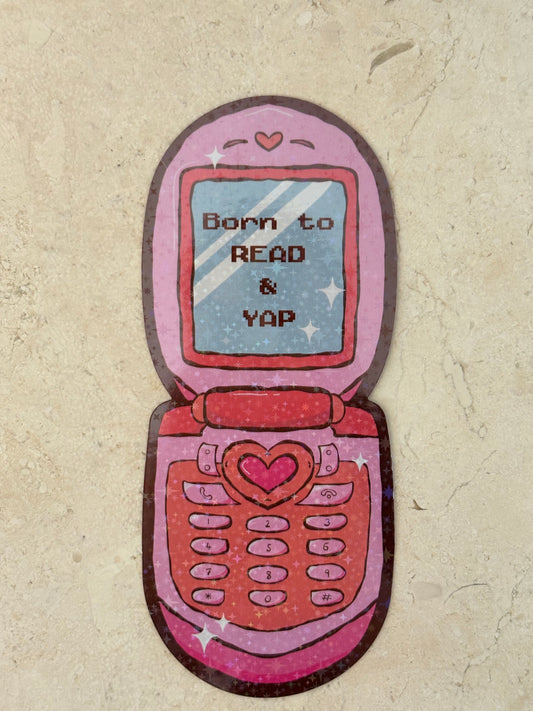 Pink retro flip phone sticker with text 'Born to READ & YAP' and heart details.